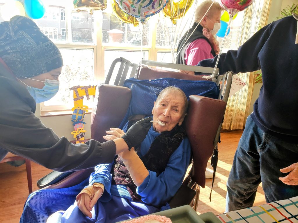 Home hospice patient enjoys cake at her birthday party