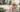 Older man sitting outside in the shade