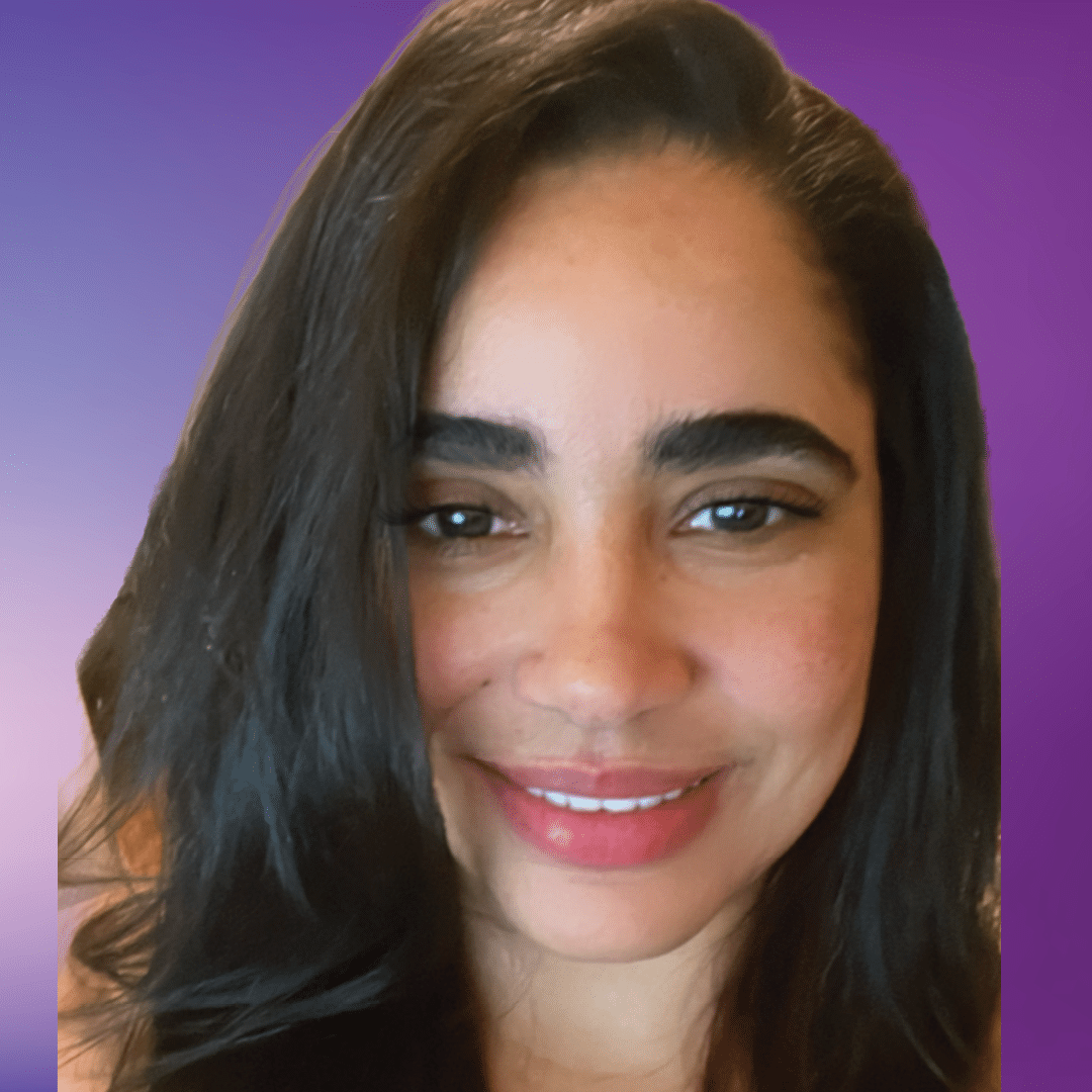 Headshot of team member Clara on purple background