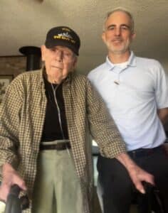 Veteran and skilled home health patient Tolley pictured next to his physical therapist, Casey.